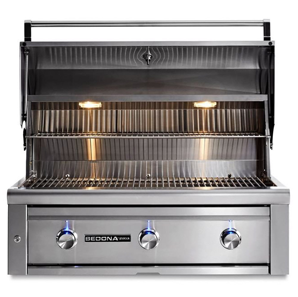Built-in gas grill with hood open, stainless burners and grate, three knob controls