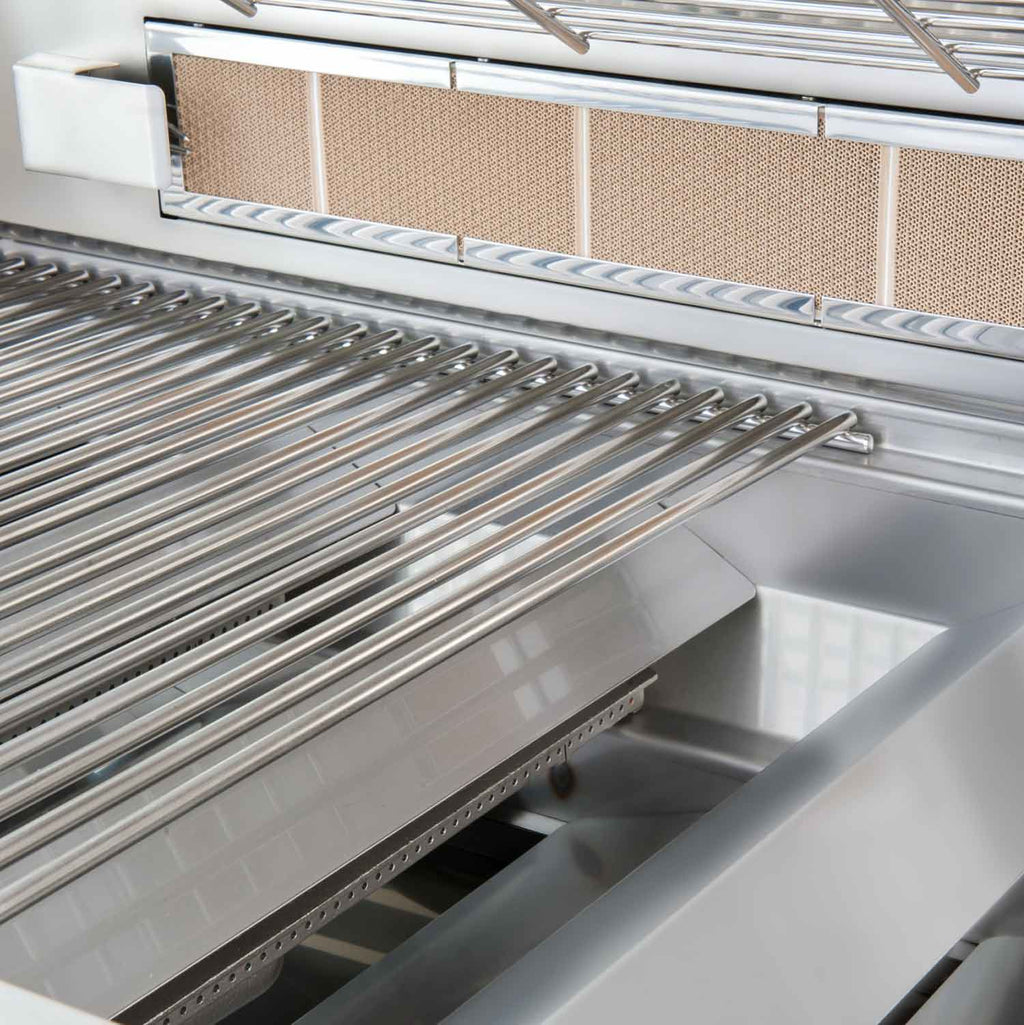 Stainless steel cooking grates and metal heat shields inside the grill firebox
