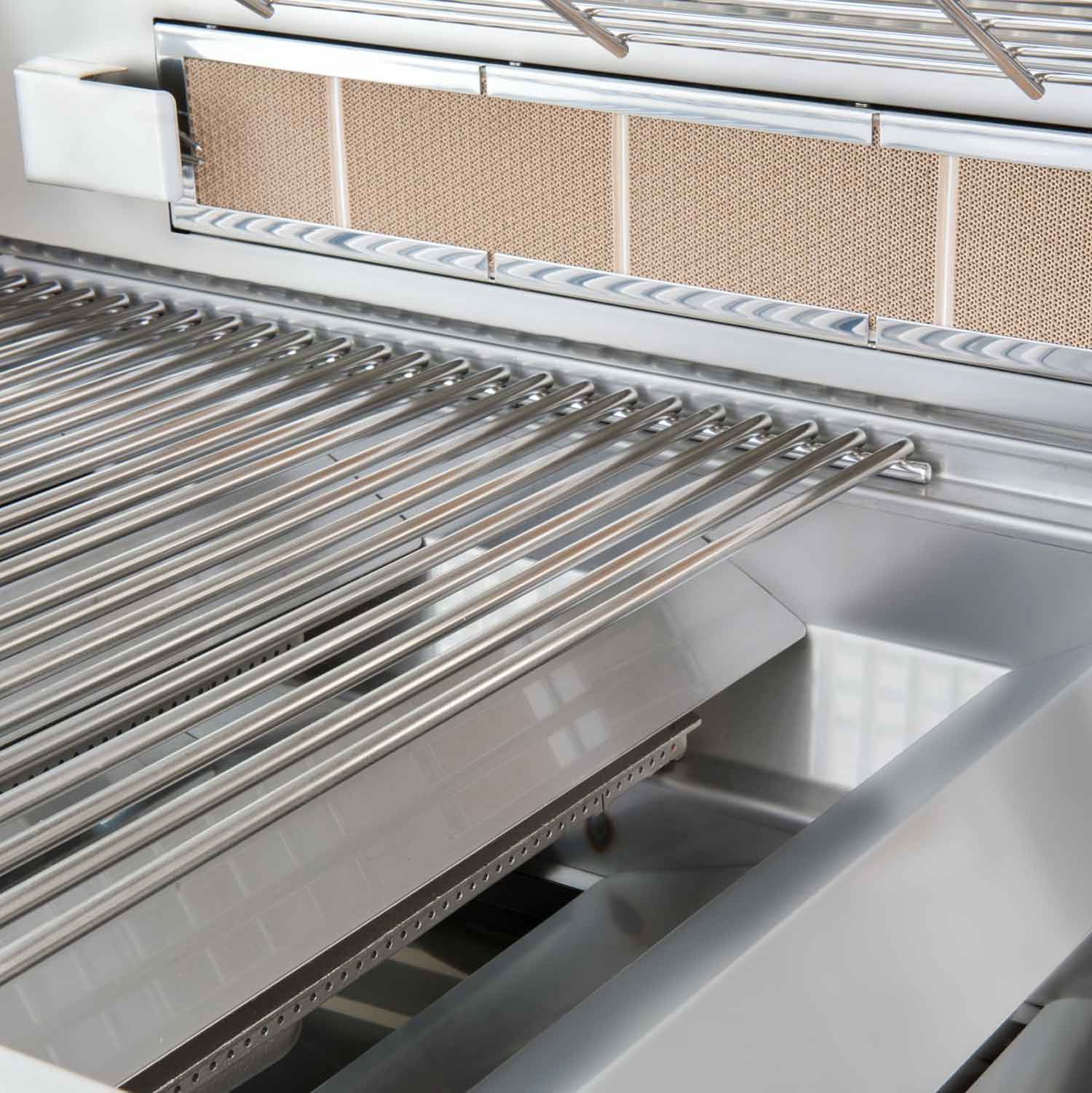 Stainless steel cooking grates and metal heat shields inside the grill firebox
