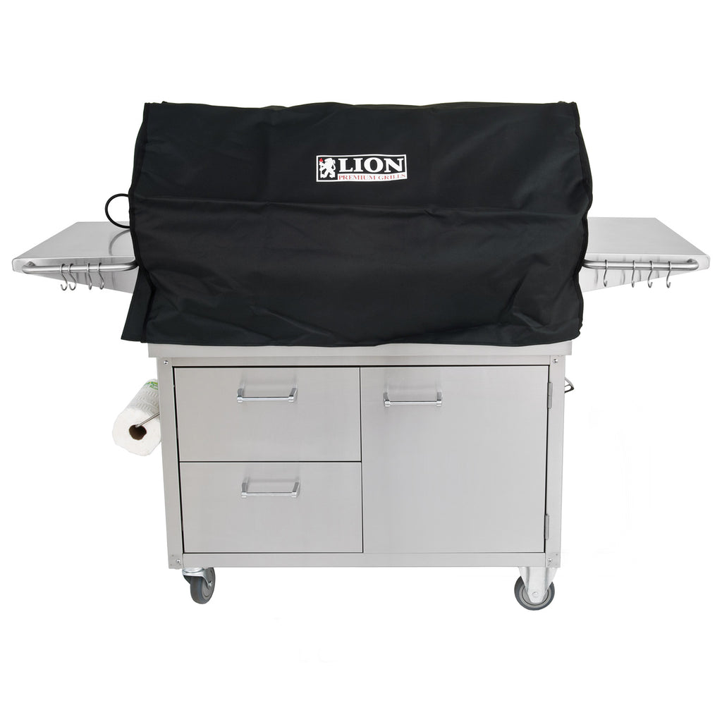 Freestanding grill with black cover and front storage doors