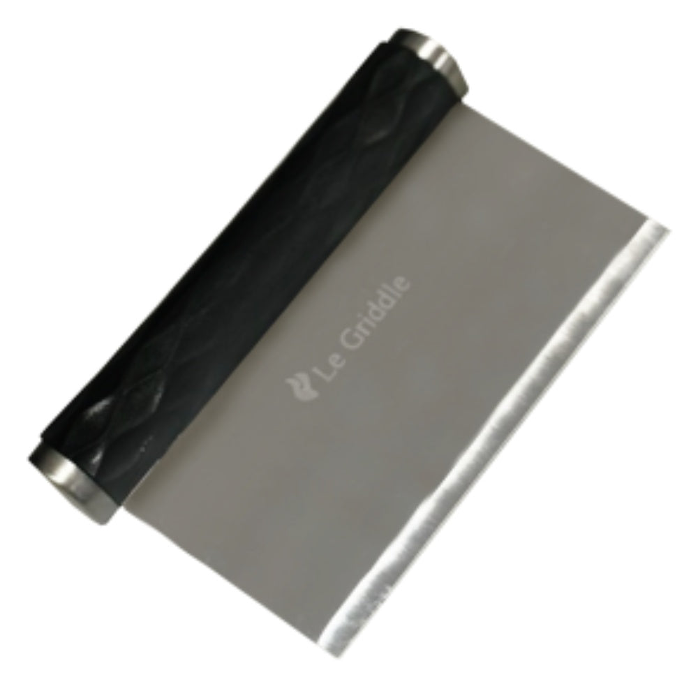 Bench scraper with black grip and stainless-steel blade, angled for food cleanup