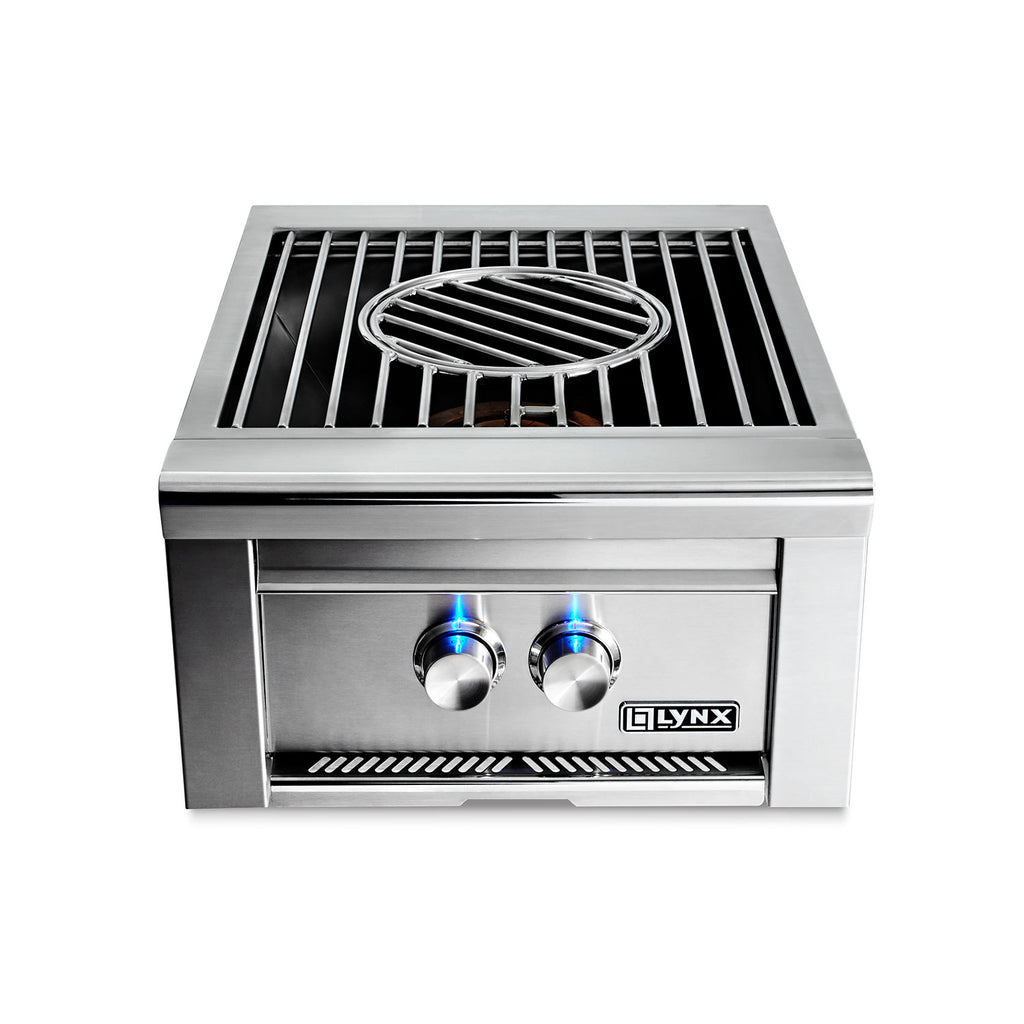 Built-in gas power burner with stainless housing and blue flames on the grate