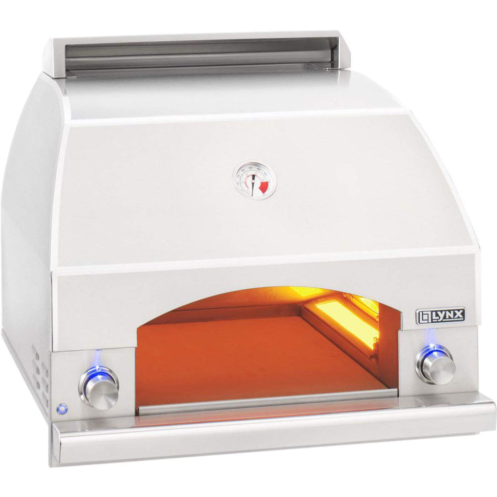 White pizza oven with open front, yellow interior glow, LYNX badge, and side knobs