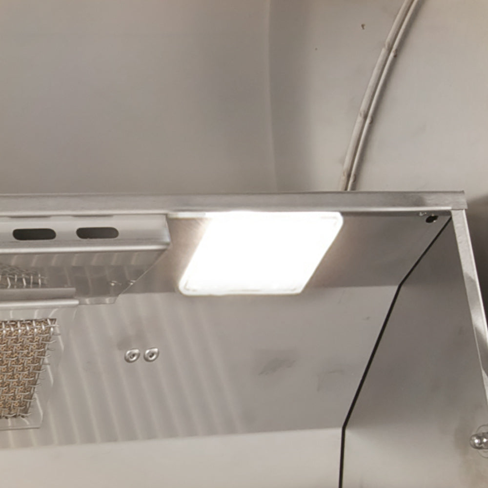 Grill hood interior light fixture under open lid