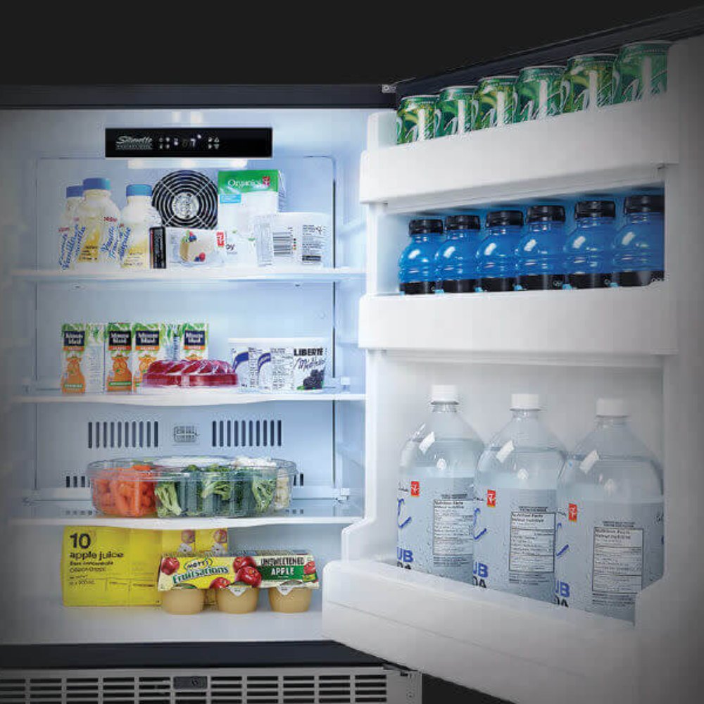 White refrigerator interior with door bins, bottles, and lit multi-shelf storage