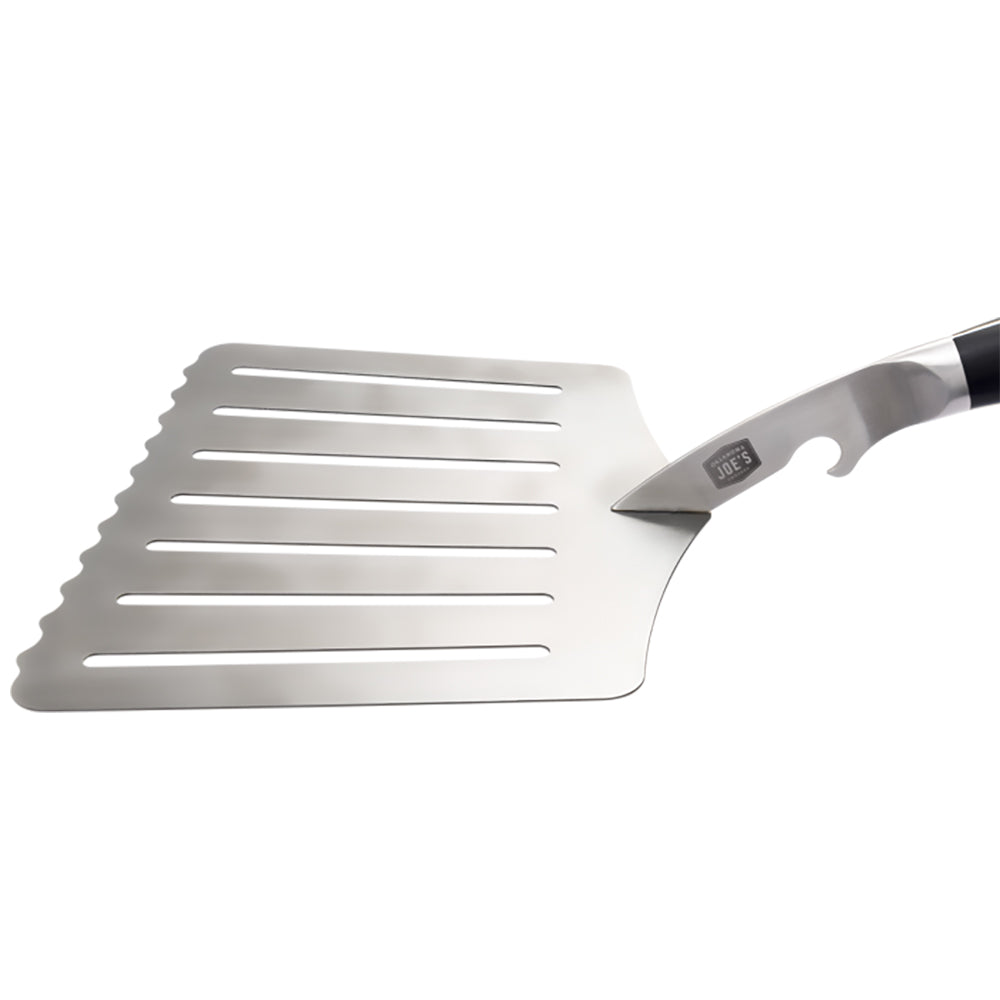 Oversized hawg lifter spatula with ribbed slotted head and black-and-silver handle