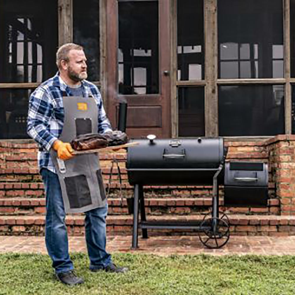 Gray canvas smoking apron with adjustable straps and large black front pocket