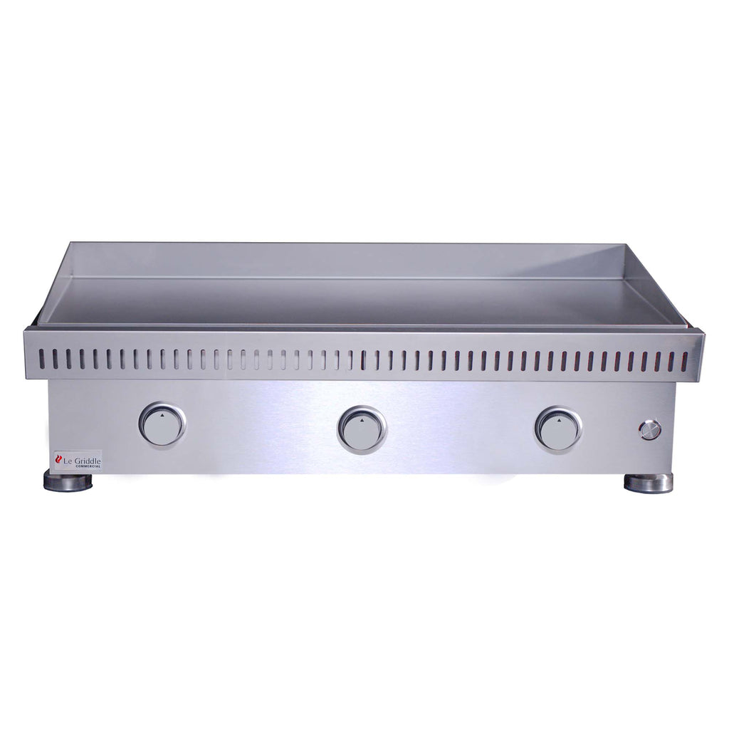 Built-in stainless gas griddle with raised backsplash, three knobs, and side control