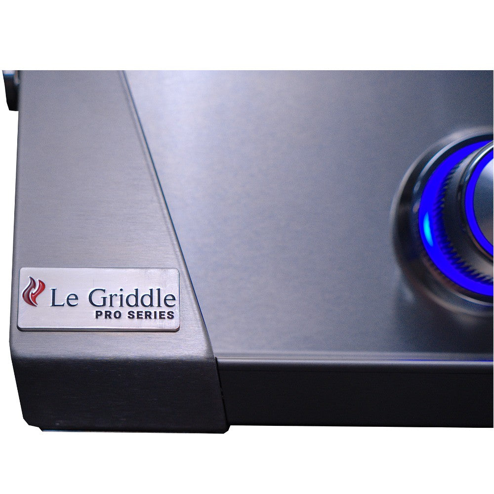 Stainless gas griddle control corner with Le Griddle Pro Series badge and blue knob