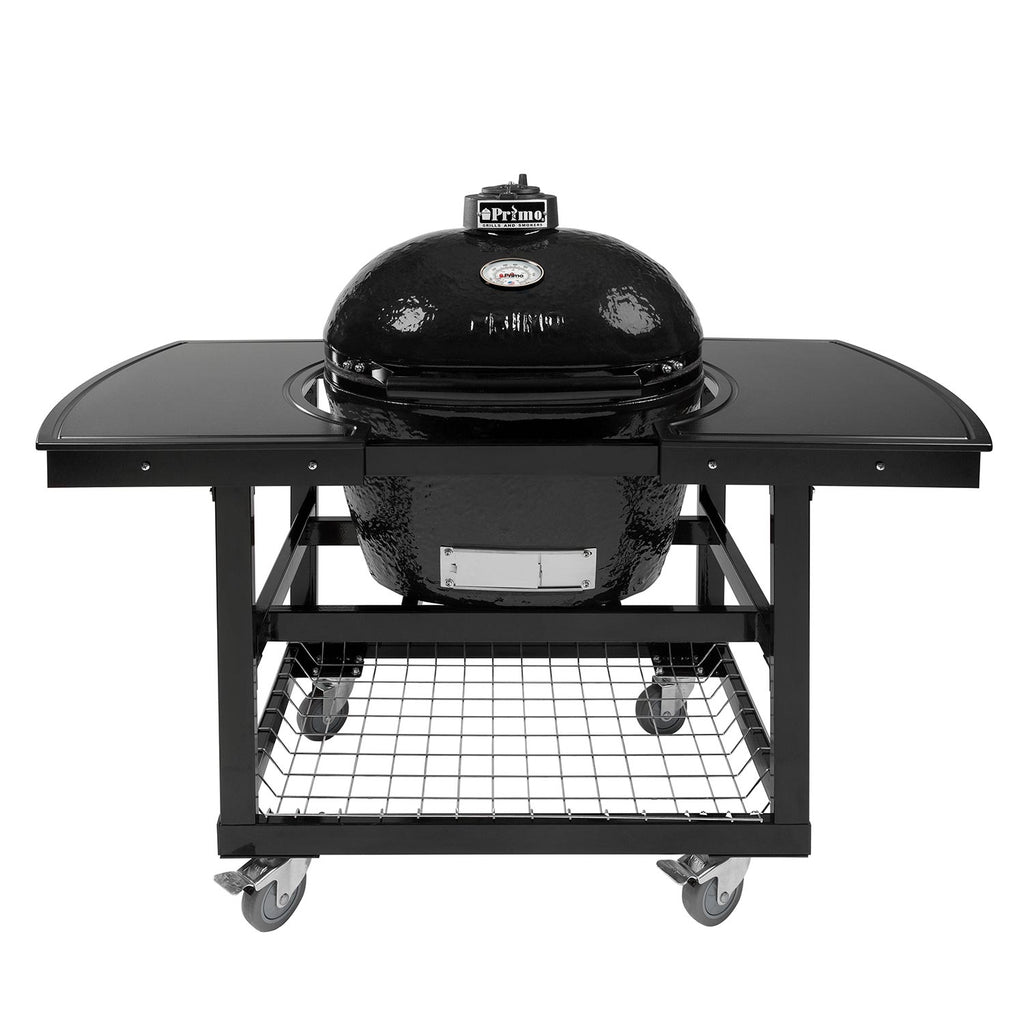Charcoal ceramic kamado grill with oval lid and side shelves on rolling cart