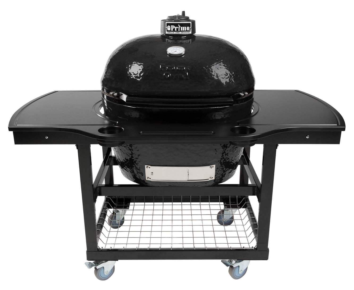 Oval ceramic charcoal kamado grill on wheeled cart with side shelves and lower cooking grate