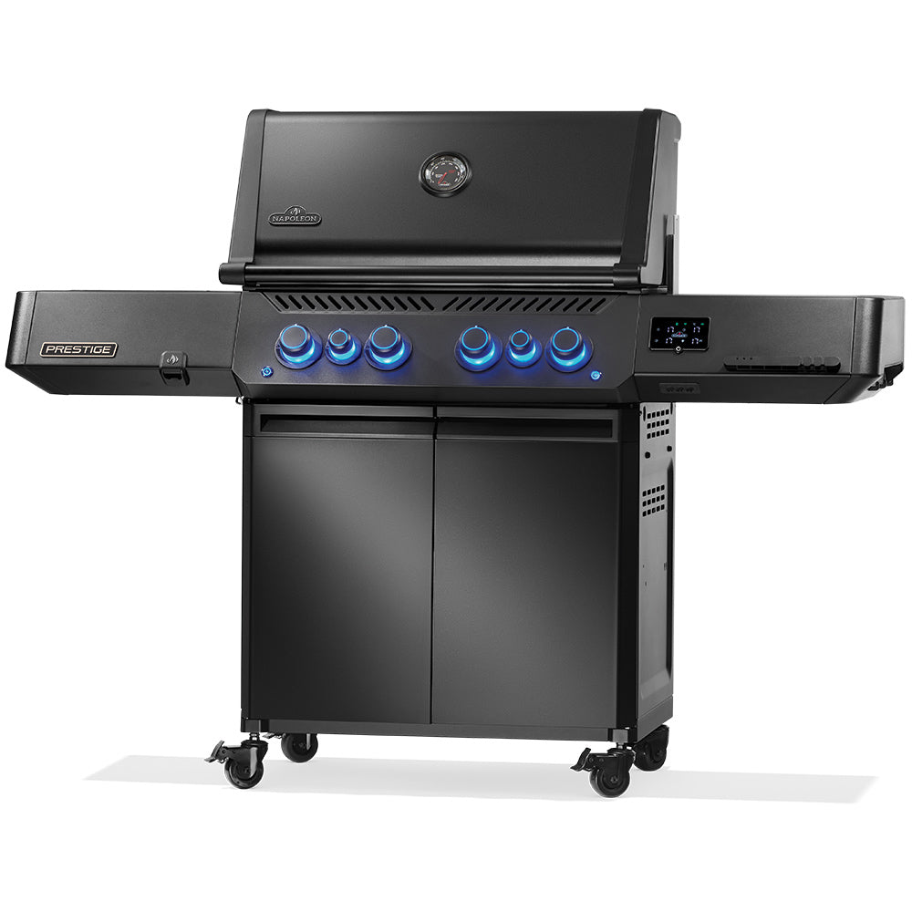 Napoleon Prestige 500 gas grill on cart with blue-lit control knobs and side panel