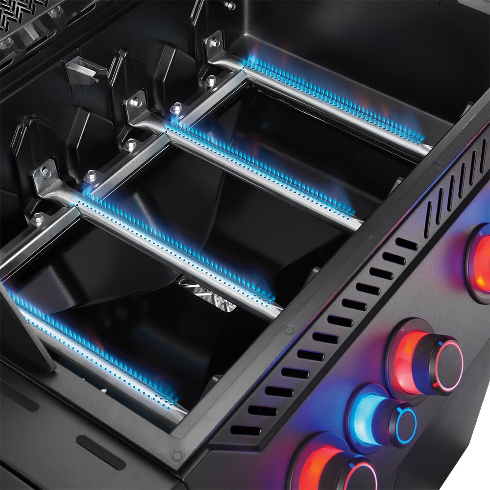 Napoleon infrared burner with blue glow and stainless heat shields inside grill