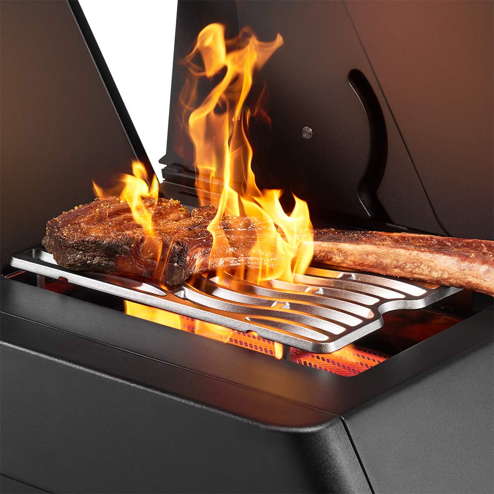 Napoleon gas grill with flames and searing burner bars above the cooking grate
