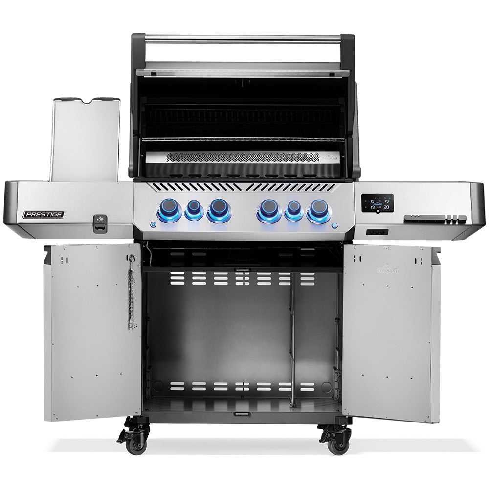 Gas grill with open hood showing grates and stainless interior cooking area