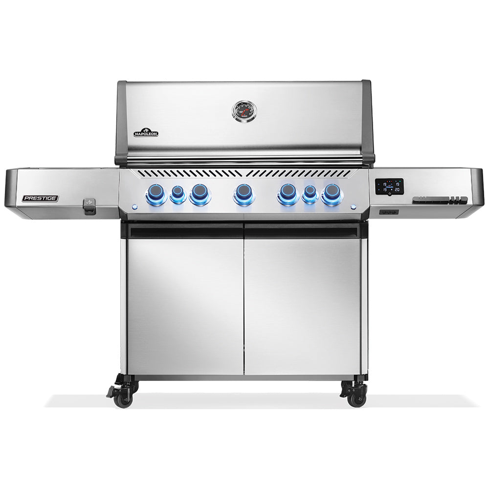 Stainless gas grill on cart with closed lid and control panel with blue knobs