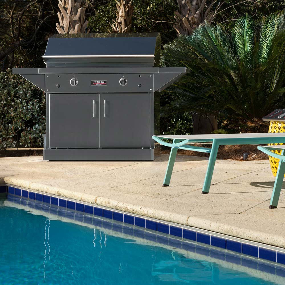 Freestanding stainless steel infrared gas grill with side cabinet doors and top control panel