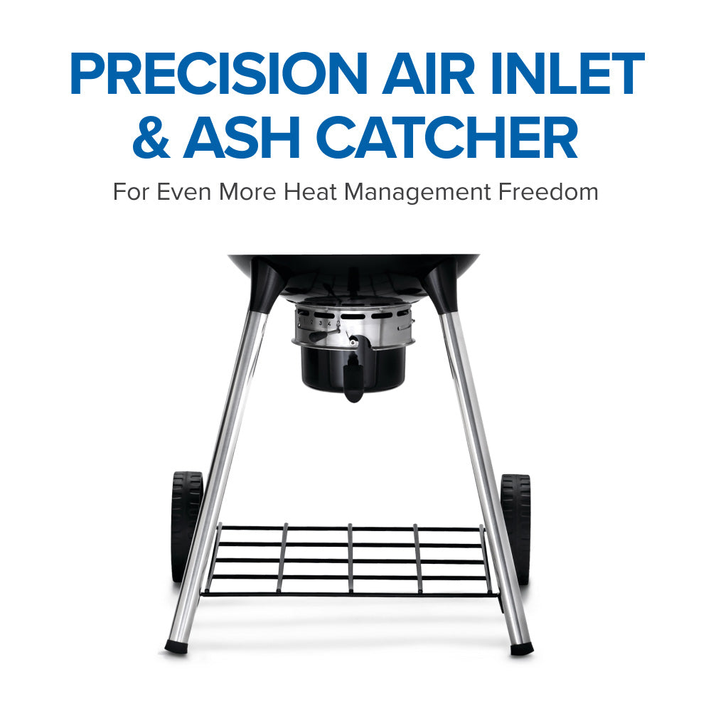 Charcoal kettle grill with ash catcher and air inlet area above the cooking grate