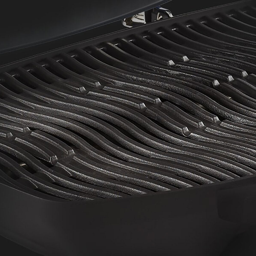 Portable grill grates with curved heat shields and small grease openings