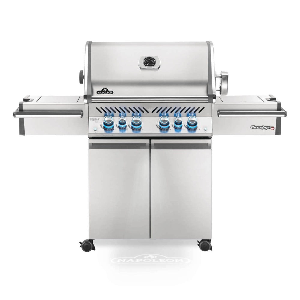 Stainless steel gas grill with six blue control knobs and side shelves
