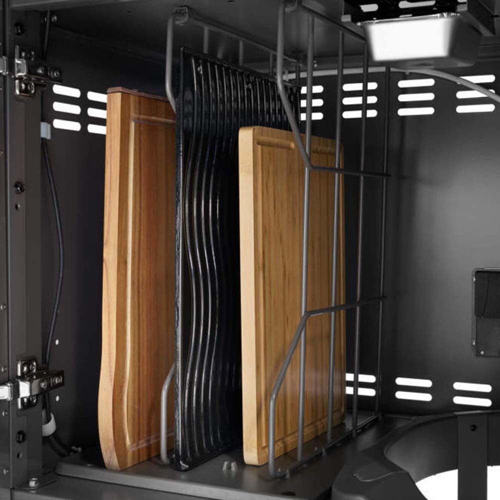 Gas grill firebox interior with vertical metal panels and wooden grilling plank supports
