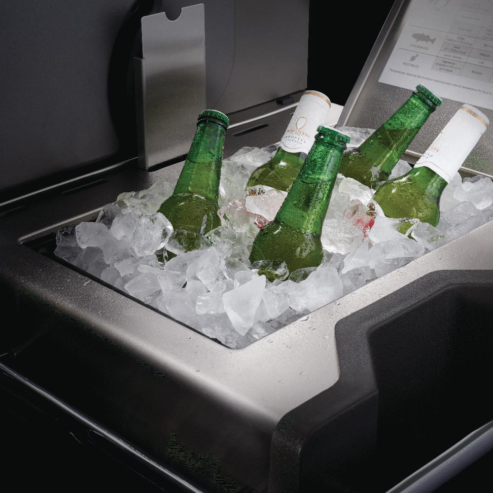 Gas grill chilling tray with bottles on ice
