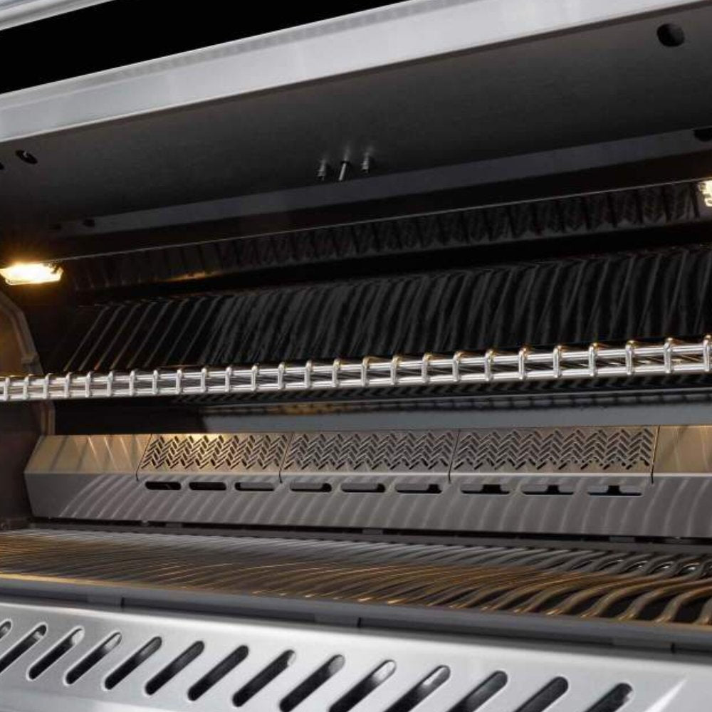 Gas grill interior with heated bars and warming rack beneath the lid