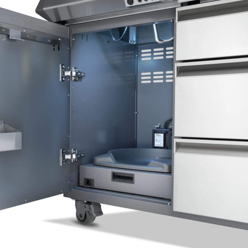 Gas grill with open side compartment showing recessed tray area