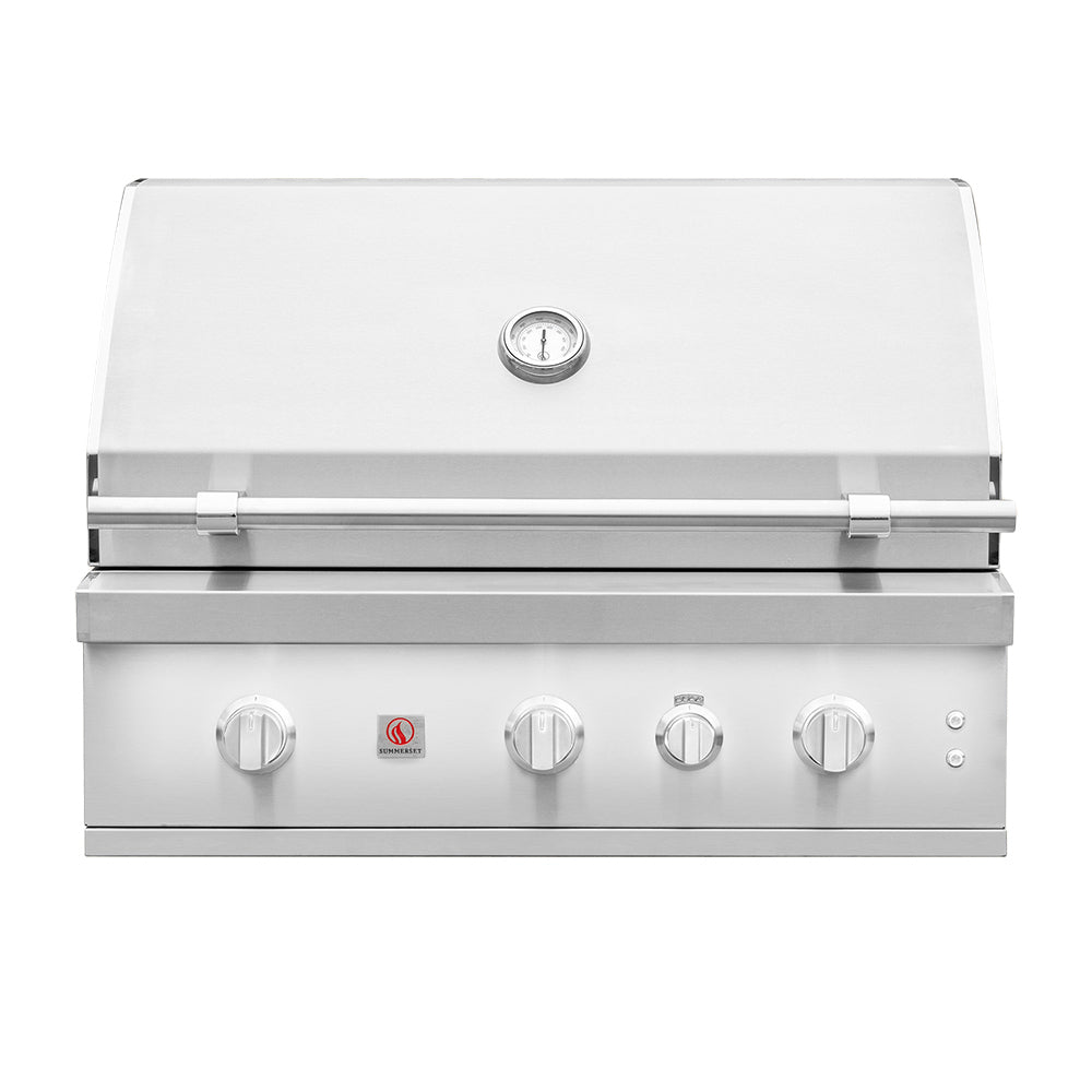 Built-in gas grill with stainless lid and front control knobs.