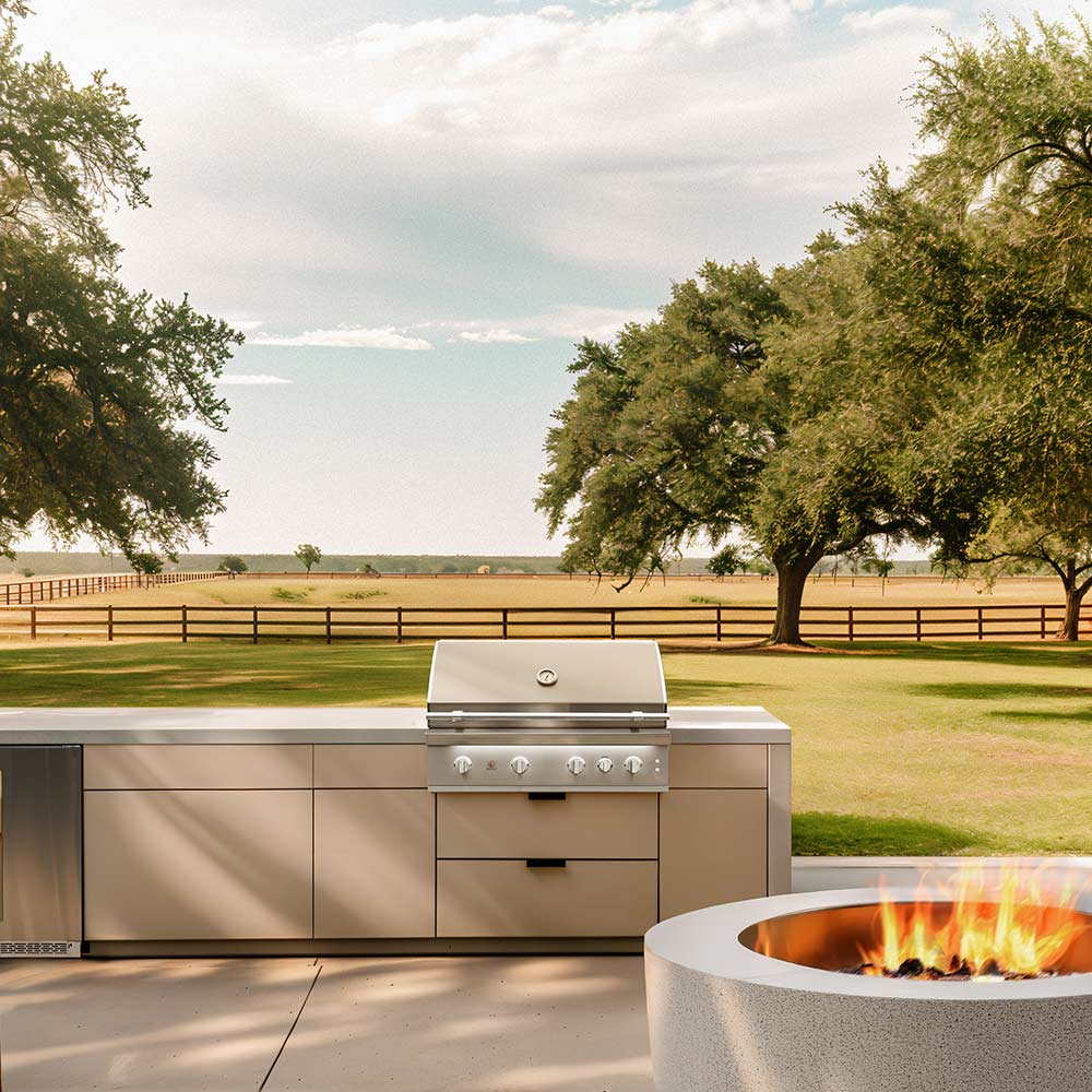 Outdoor stainless built-in gas grill with closed hood and front control knobs.