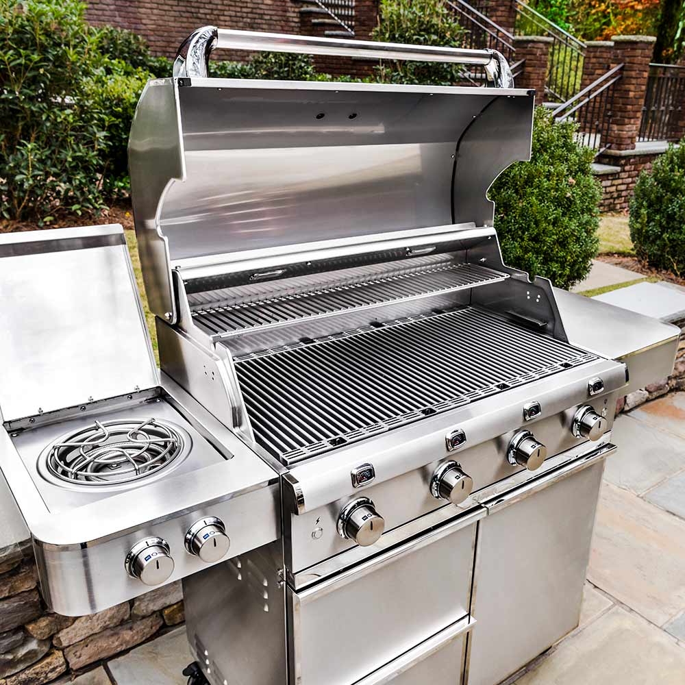 Stainless steel 4-burner infrared grill with open lid, grates, and side burner