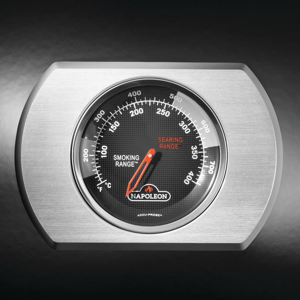 Gas grill thermometer dial with temperature markings and Napoleon branding