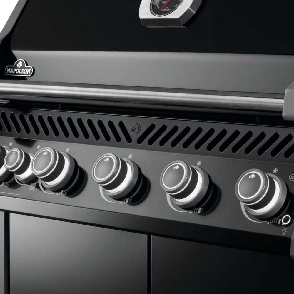 Gas grill control panel with row of round knobs and vented burner area