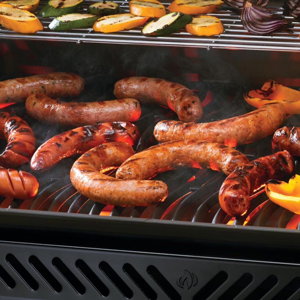 Gas grill cooking grate with browned sausages and visible grill grates