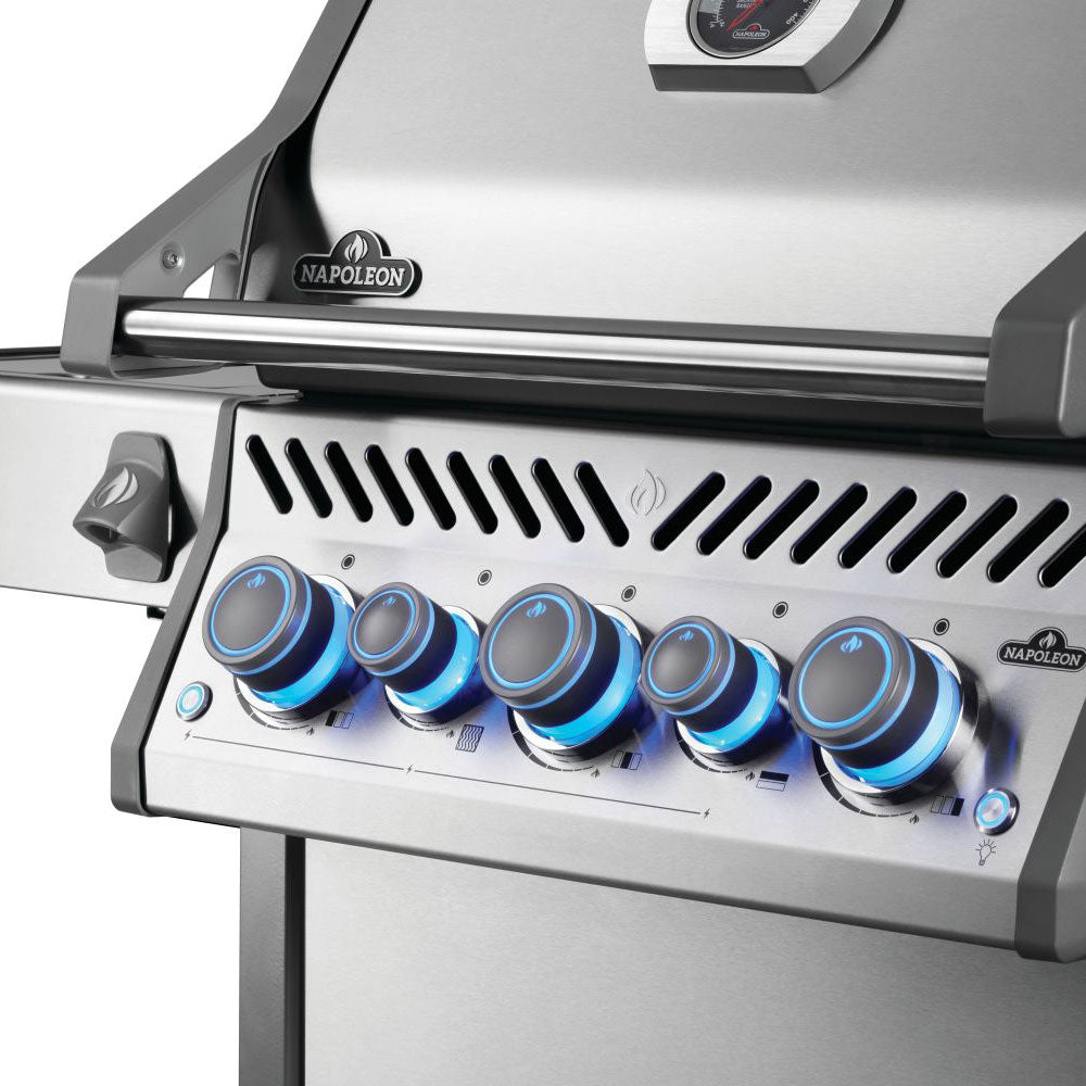 Gas grill control panel close-up with blue-knob burners and ignition control