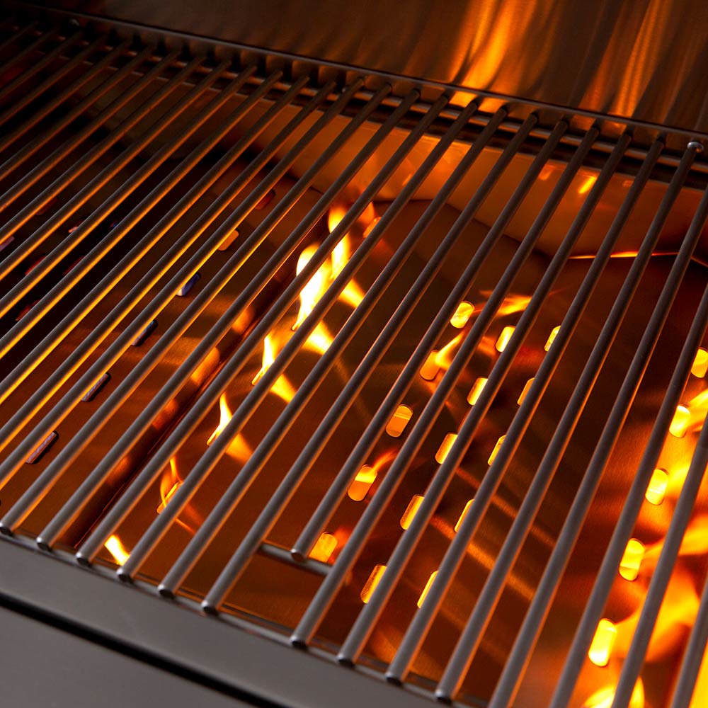 Built-in gas grill cooking grates glowing orange with active burners