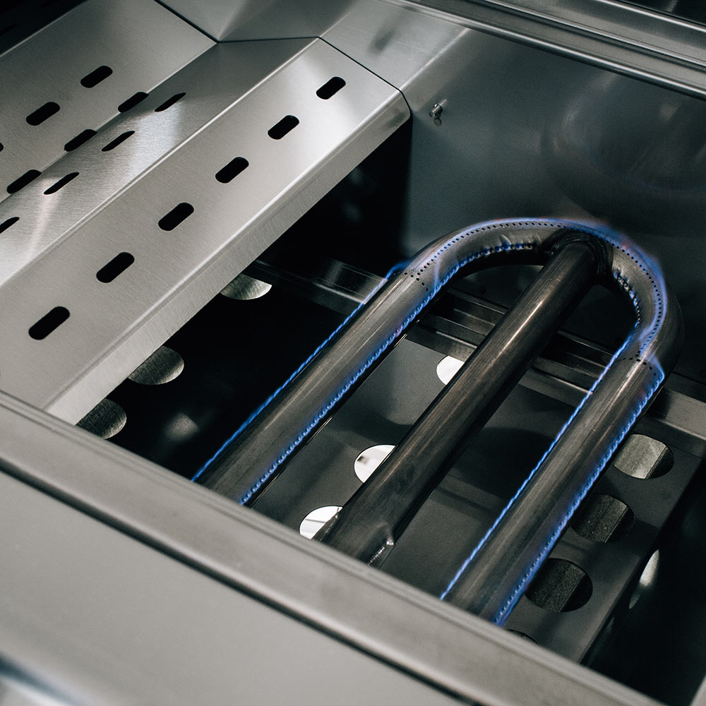 Gas grill burner tubes with grates and vent holes inside