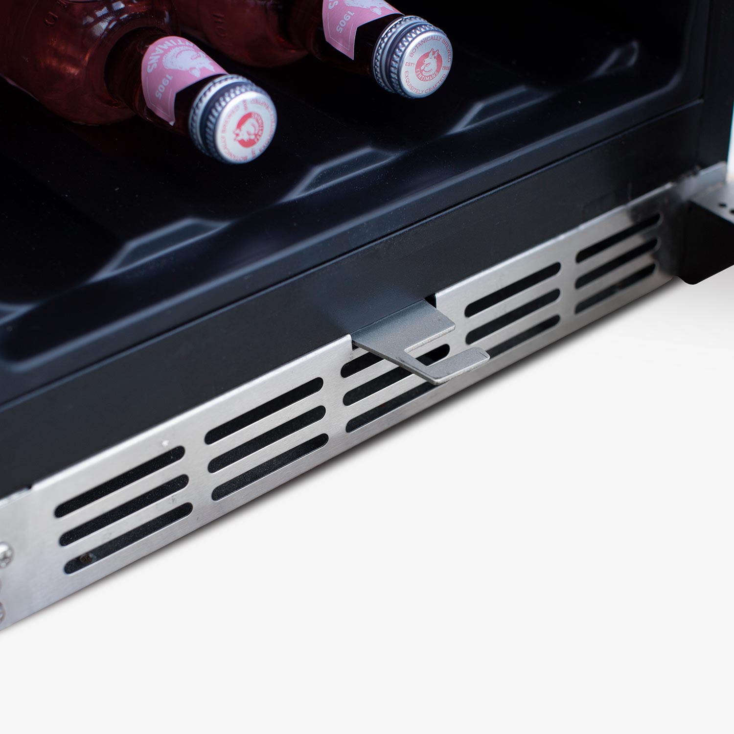 Wine cooler bottom vent grille and dark metal exterior panel
