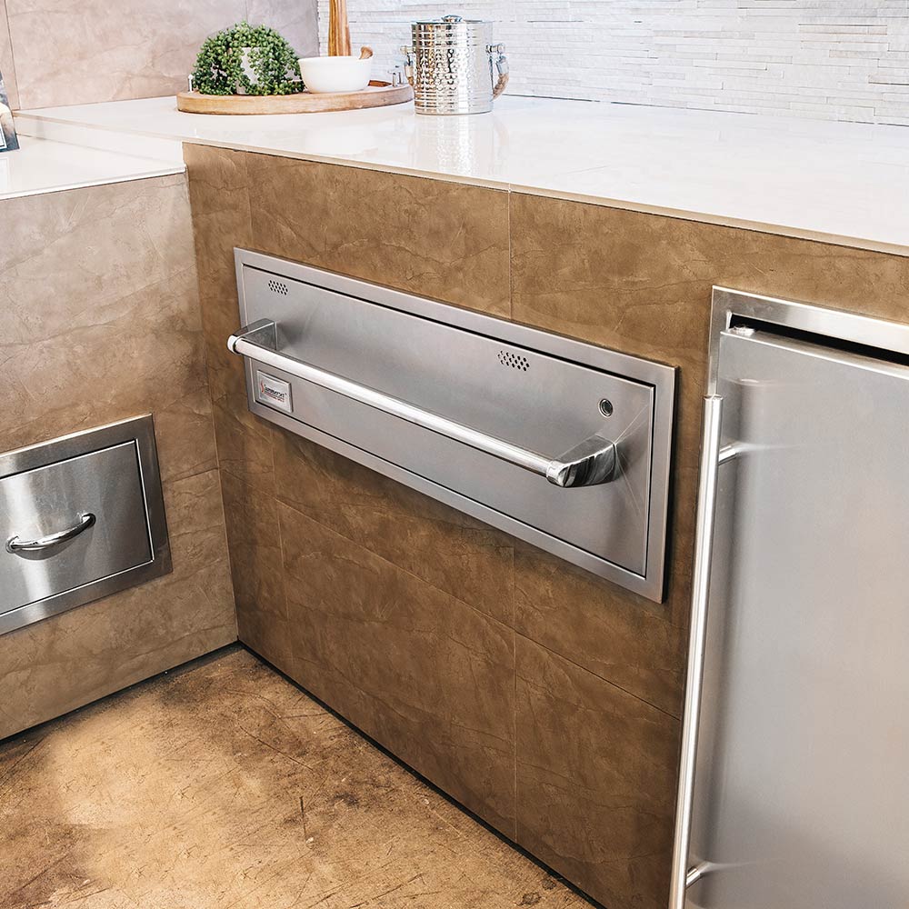 Built-in warming drawer with stainless steel door and chrome handle, front view.