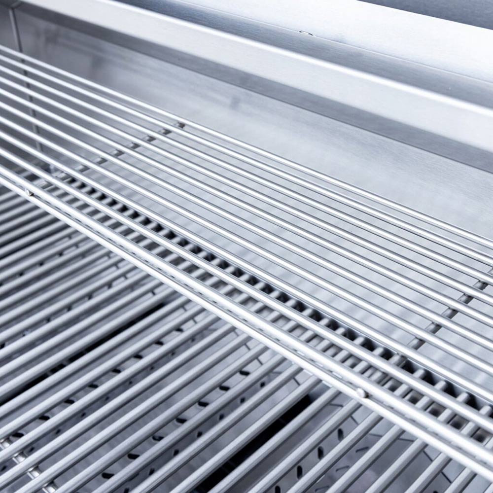 Close-up of stainless steel grill grates with parallel bars and small drainage holes
