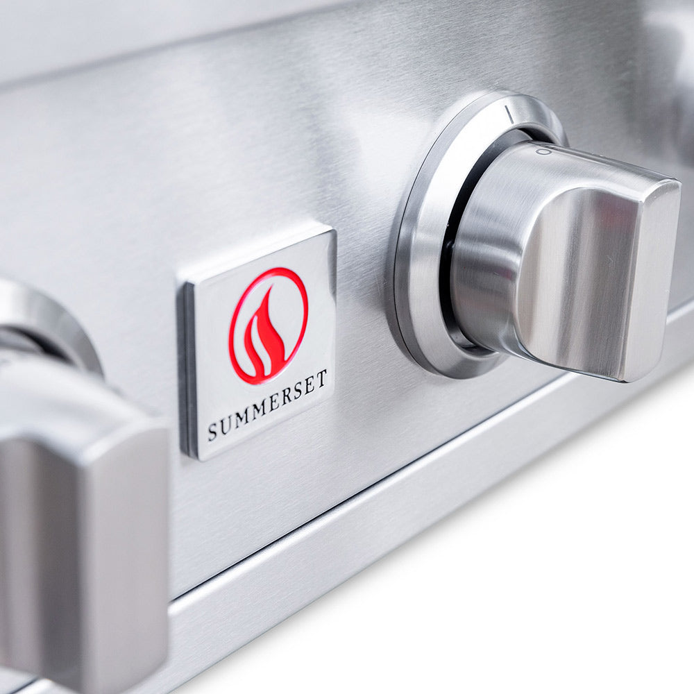 Stainless gas grill control knob with Summerset logo on control panel