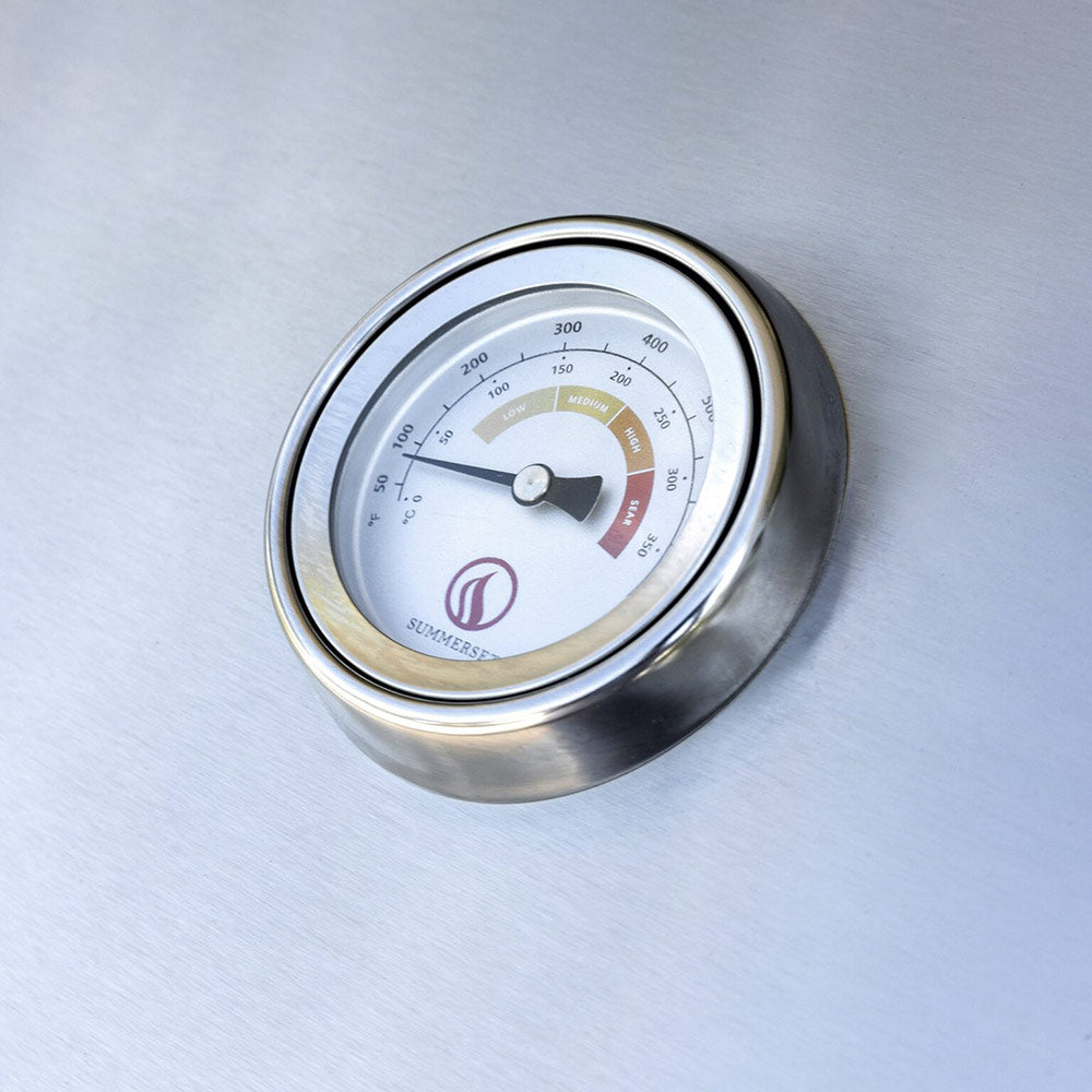 Round grill thermometer gauge on the stainless steel lid