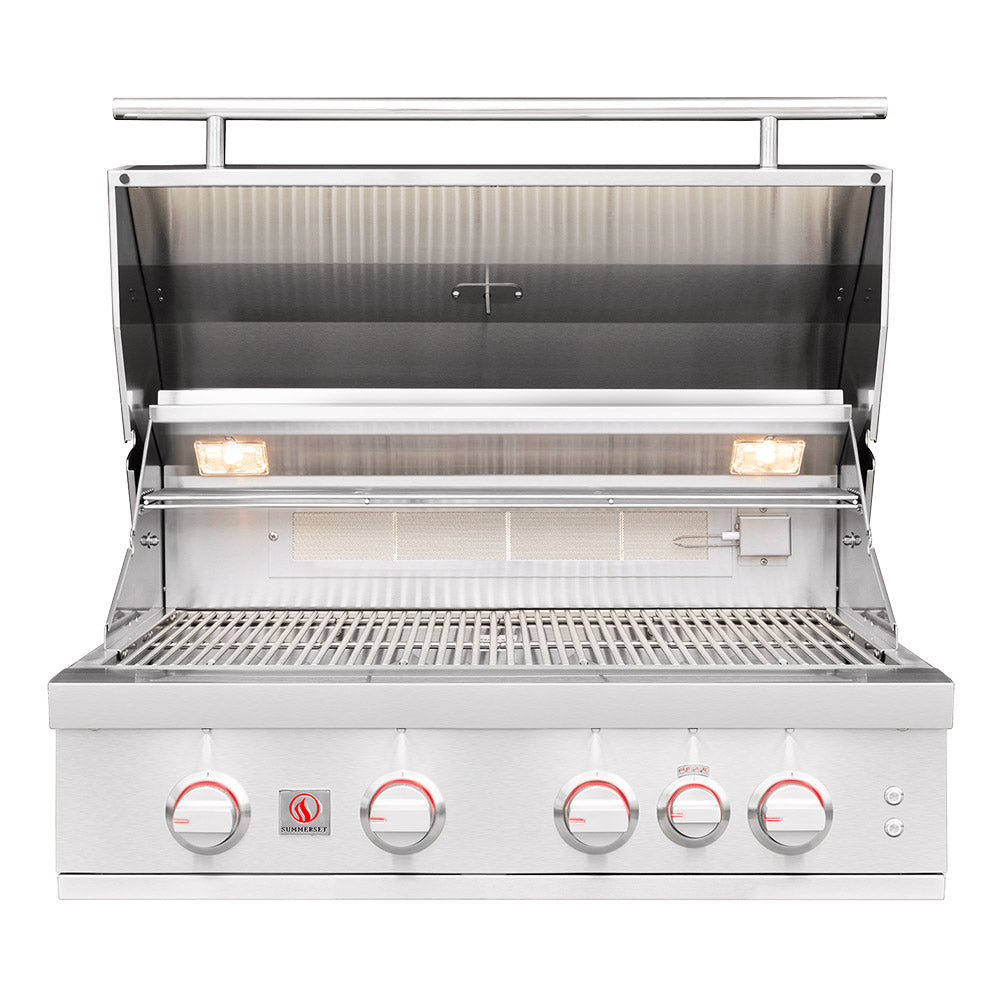 Built-in gas grill with open hood, cooking grates, and front temperature control knobs.