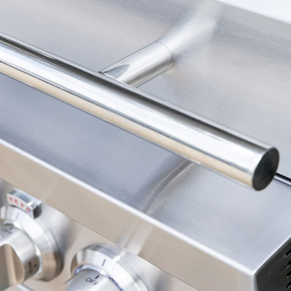 Stainless lid handle and ventilation vent tube on a built-in gas grill.