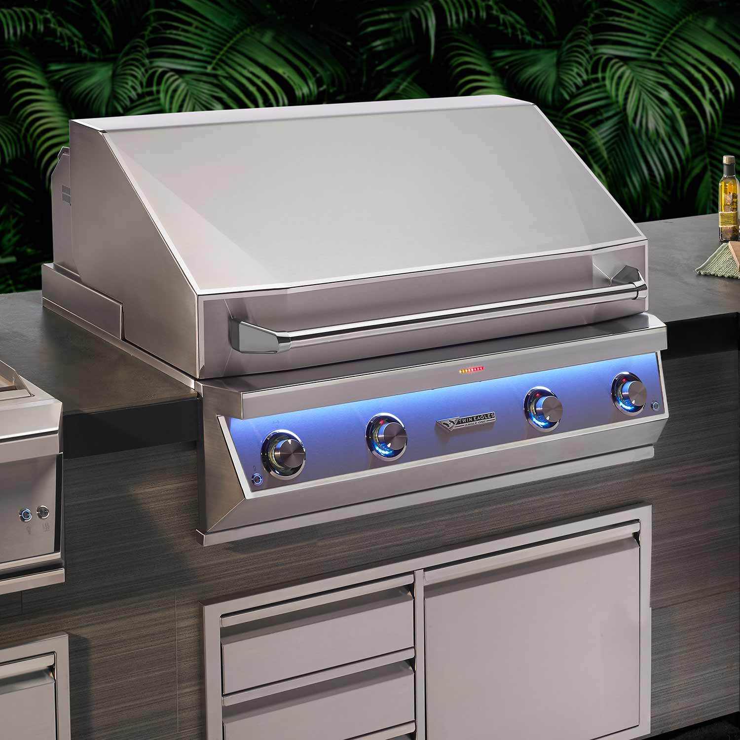 Freestanding stainless steel gas grill with open hood and control panel