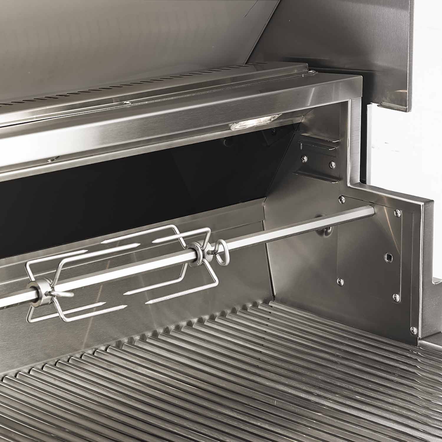 Open stainless gas grill interior with warming rack and heat shield