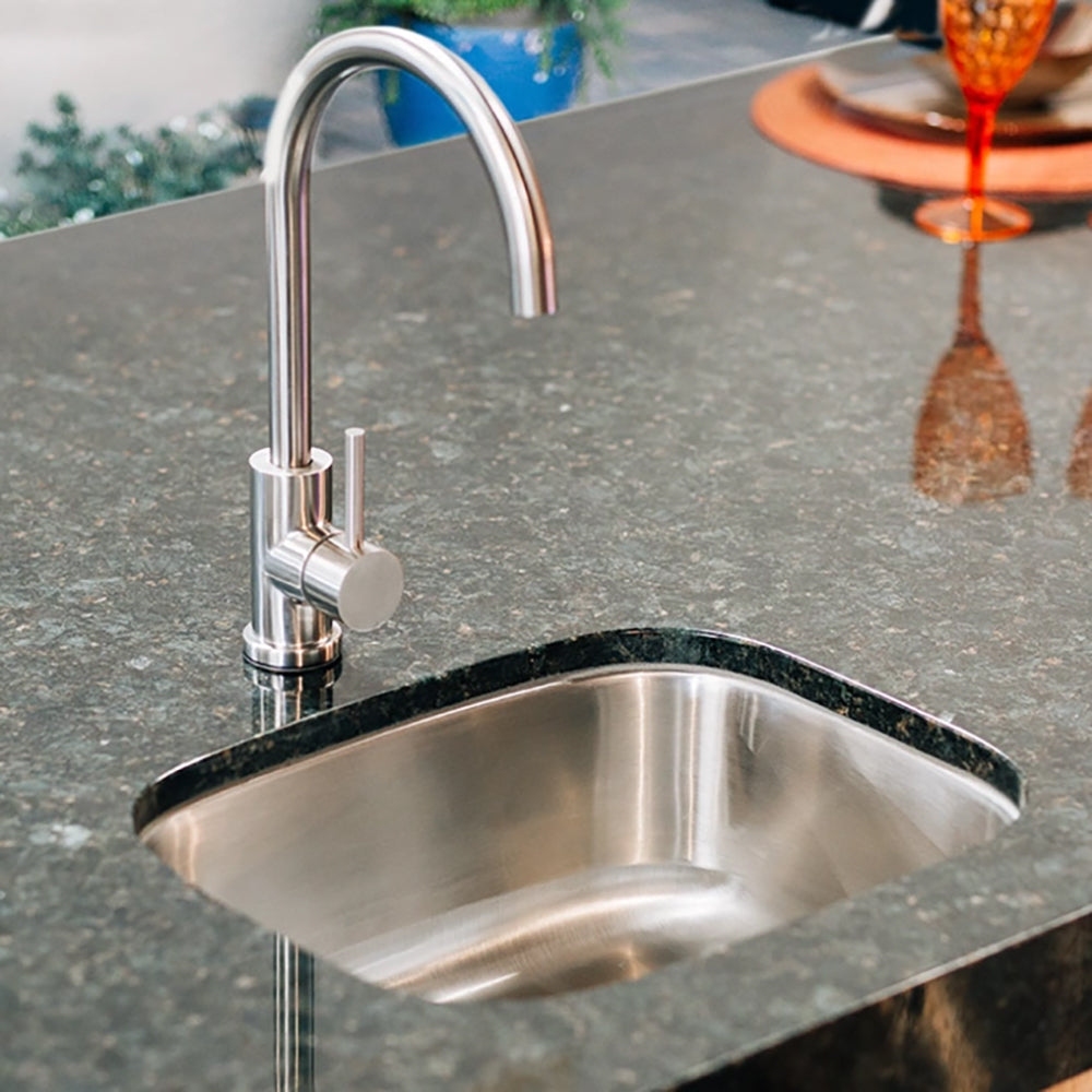Stainless undermount sink with tall faucet and circular single-control handle