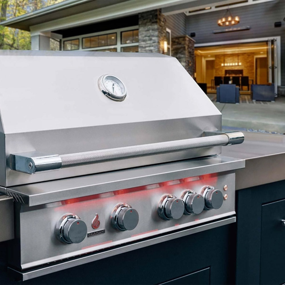 Built-in stainless gas grill side view with thermometer and control knobs