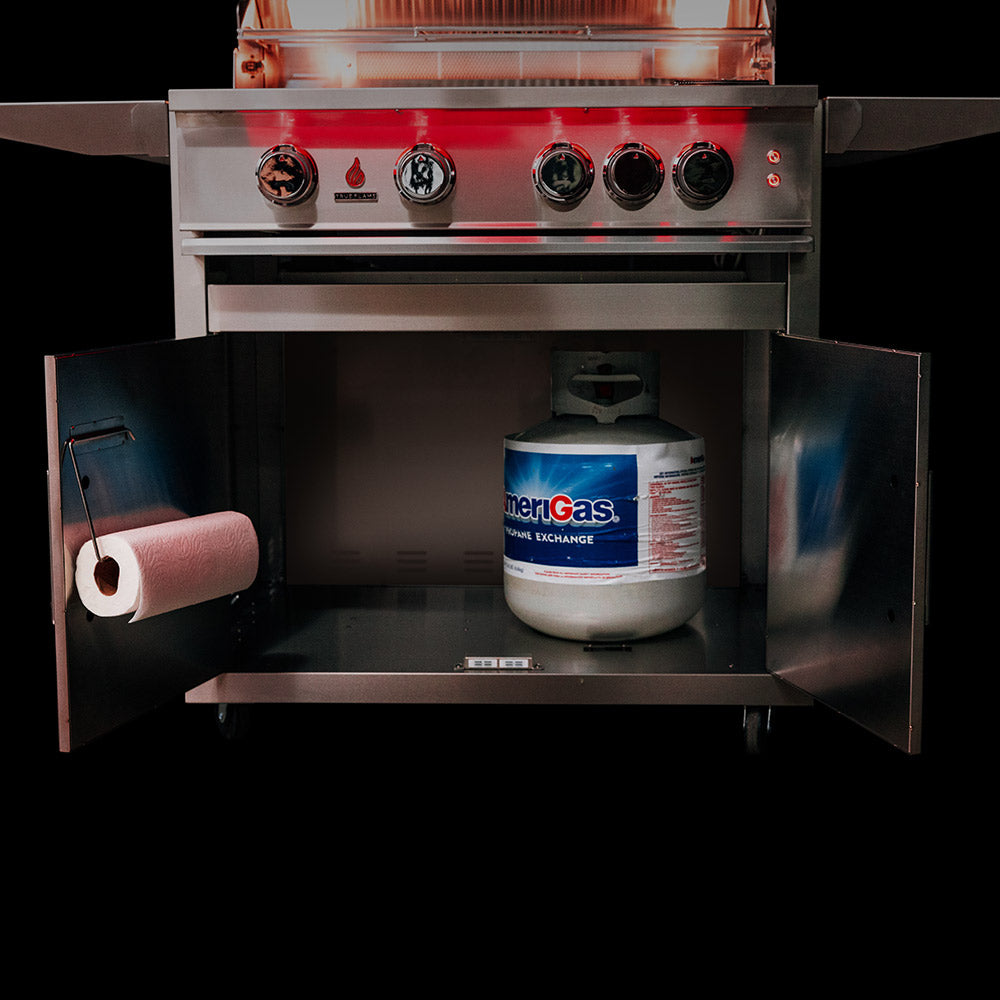 Built-in gas grill with side cabinet open showing gas cylinder storage