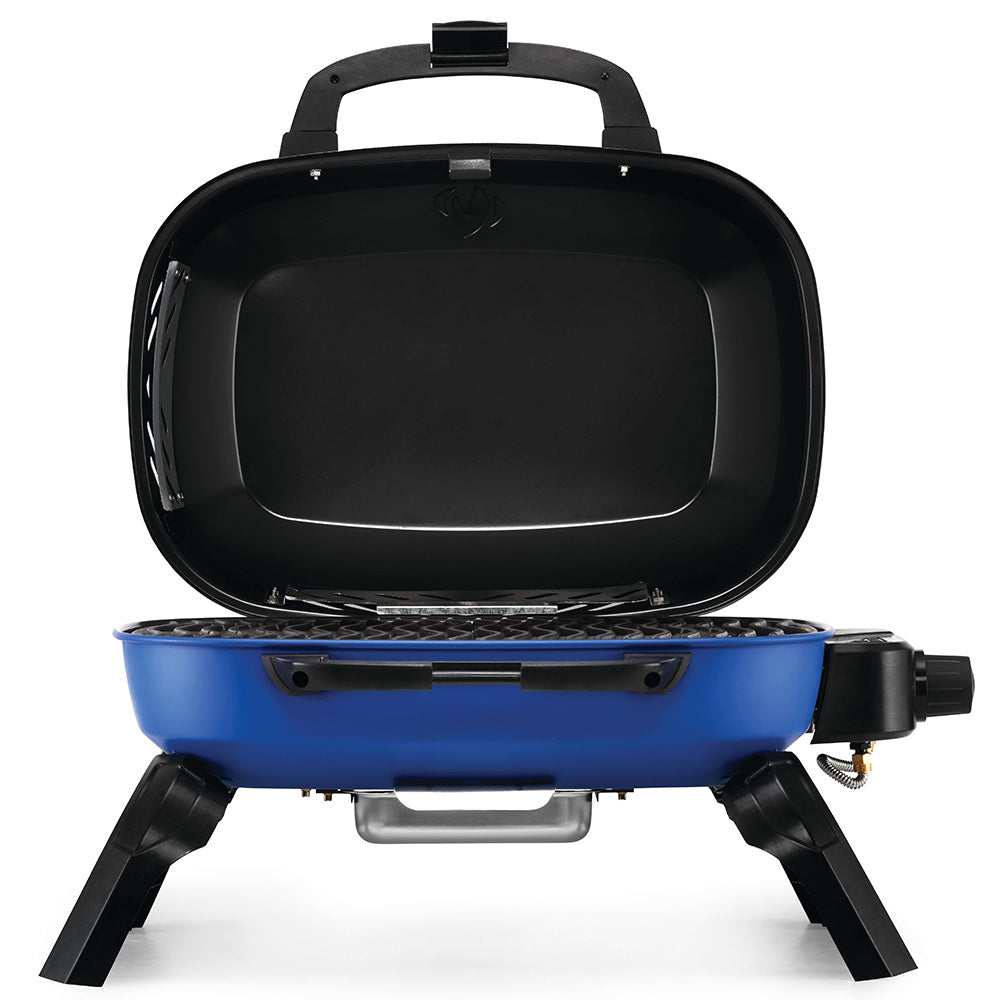 Blue portable tabletop gas grill with lid open, black cooking surface inside